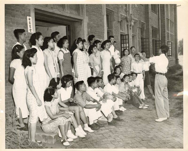 Students singing college songs after class